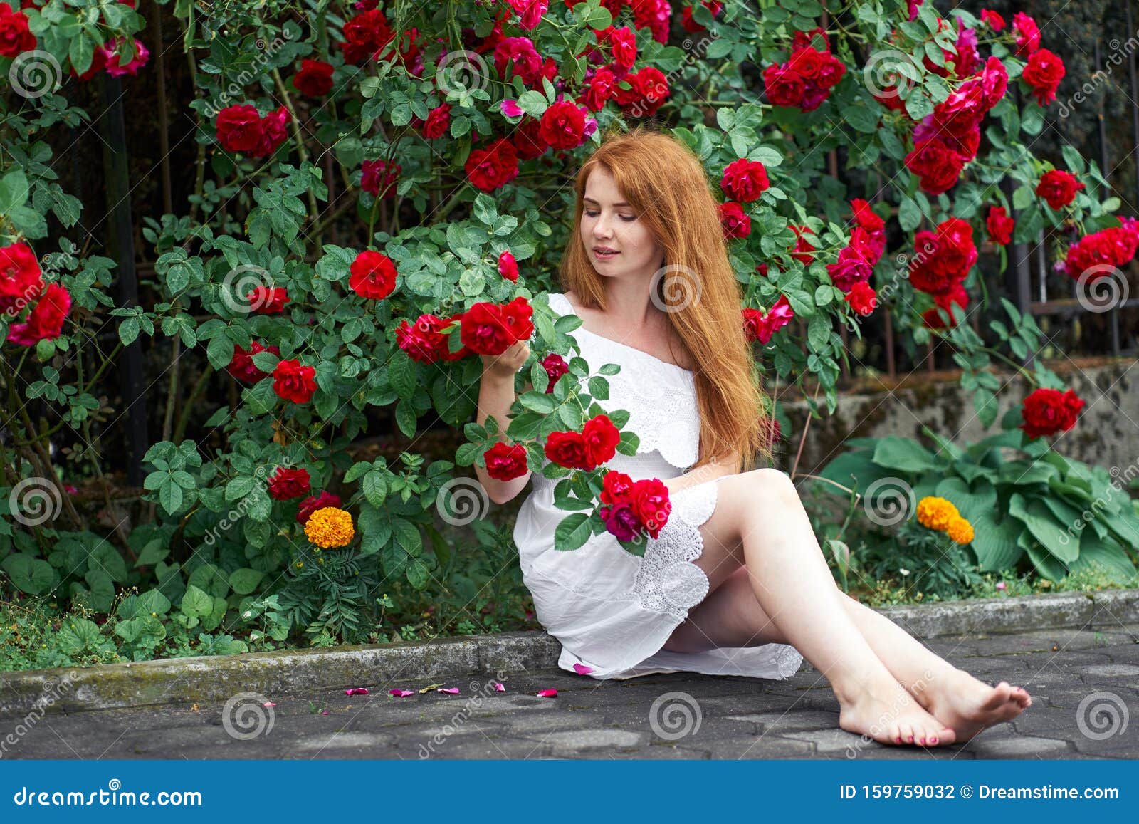 Beautiful Redhead Girl With Bare Feet Wearing In A White Stylish Dress