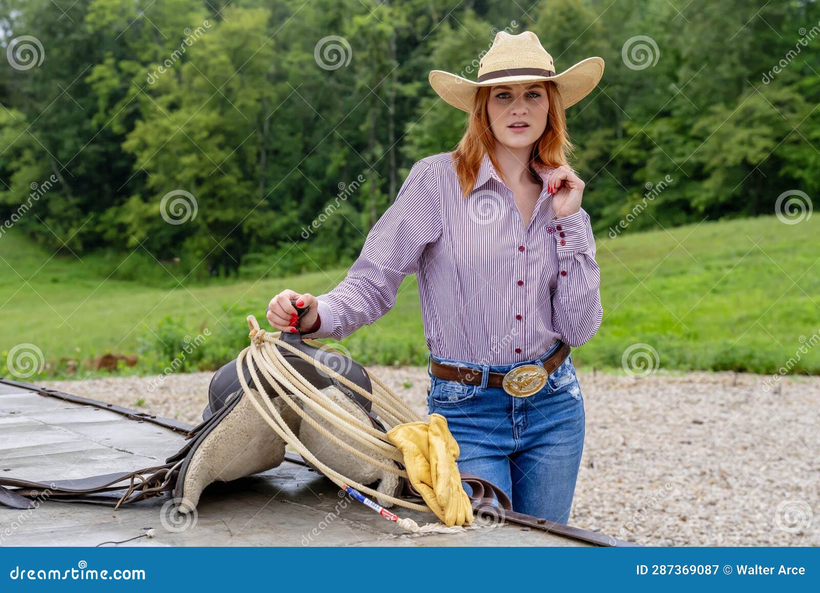 A Lovely Red Headed Country Wetern Model Poses Outdoors in a Country ...
