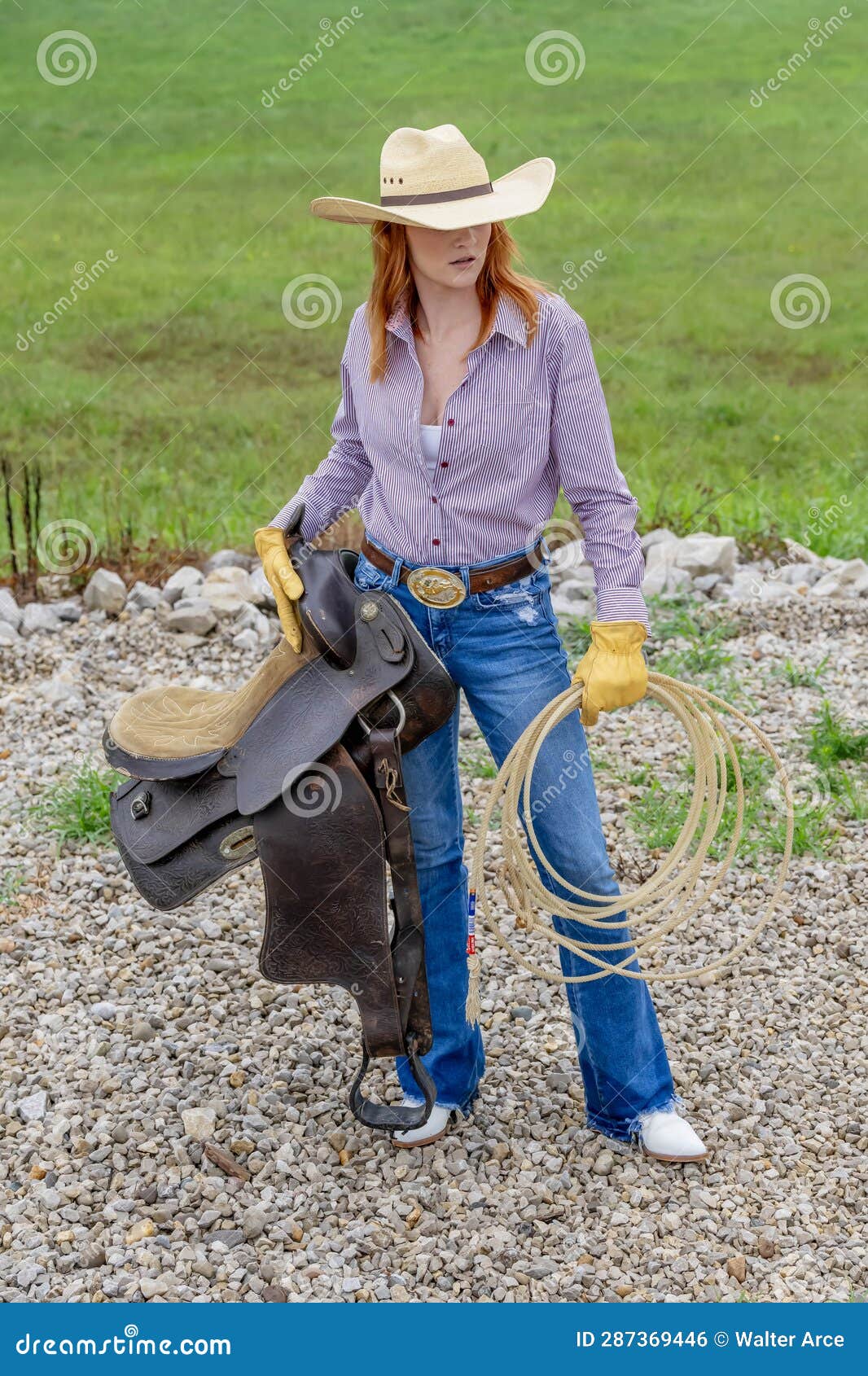 A Lovely Red Headed Country Wetern Model Poses Outdoors in a Country ...