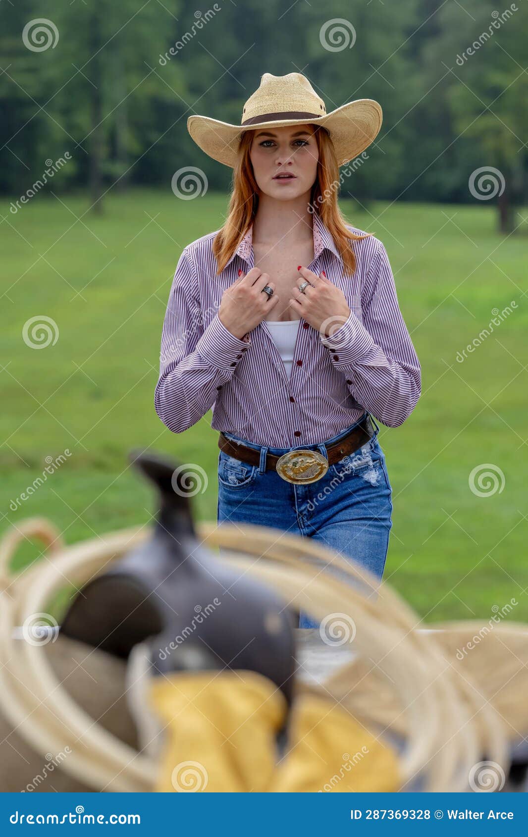 A Lovely Red Headed Country Wetern Model Poses Outdoors in a Country ...