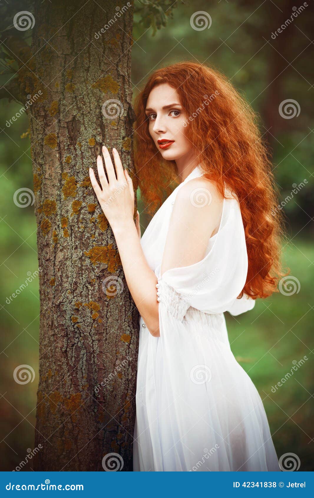 Beautiful Redhead Woman Wearing White Dress Stands Near Tree Stock ...