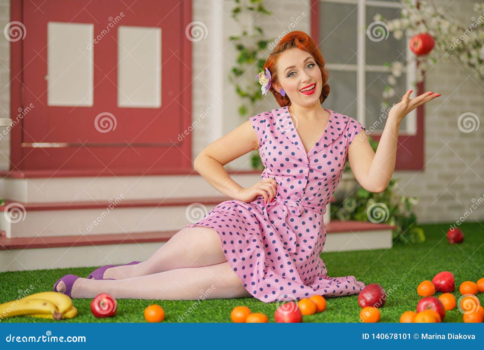 Beautiful Redheaded Pin Up Girl In Pink Polka Dot Dress And Vintage