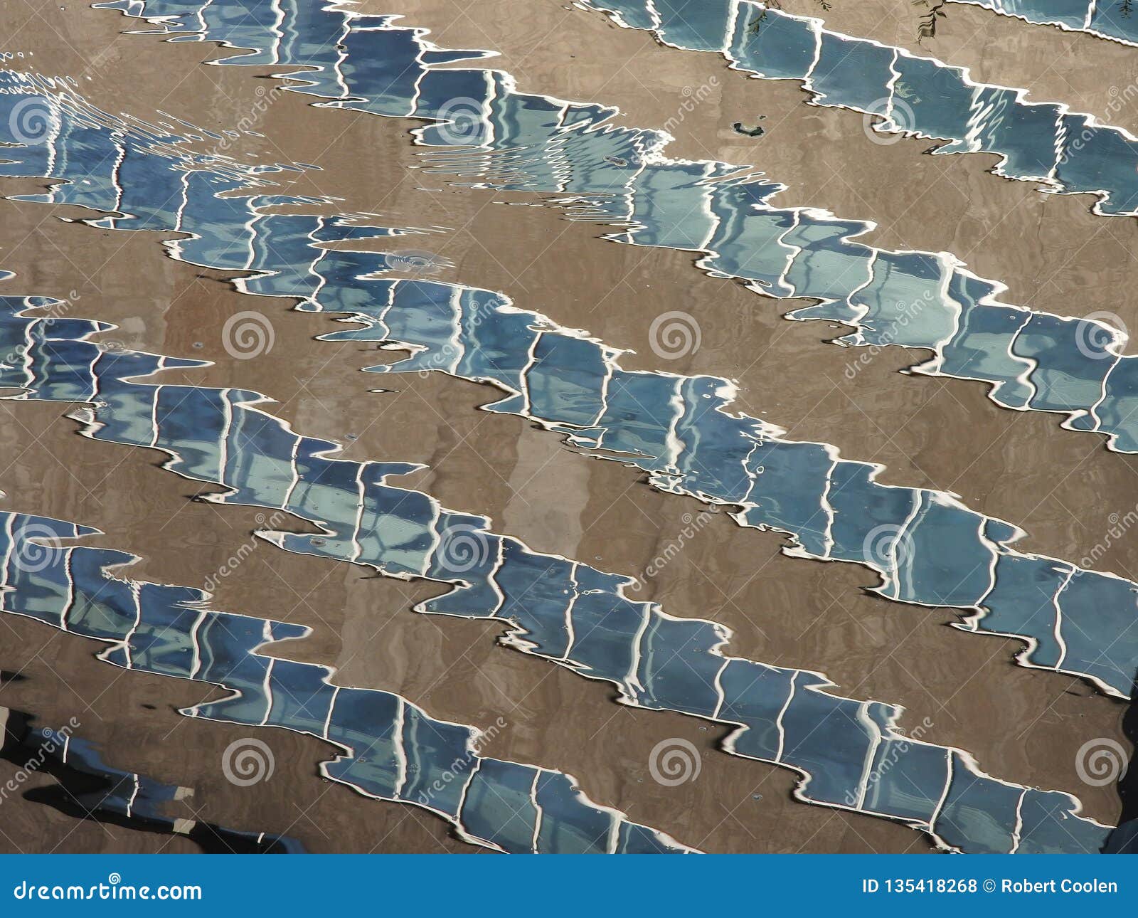 beautiful reflection mirror of building in running water, flow and river. shutter high speed photograpy. blue and grey. art.