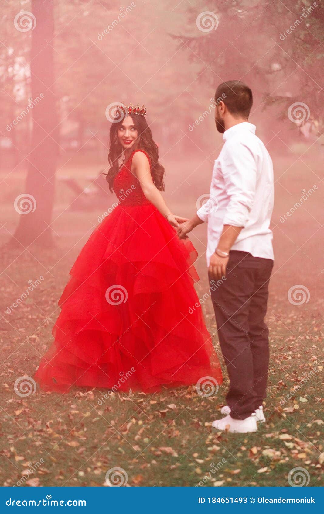 Models Posing in Red Wedding Dress and Tuxedo by River · Free Stock Photo