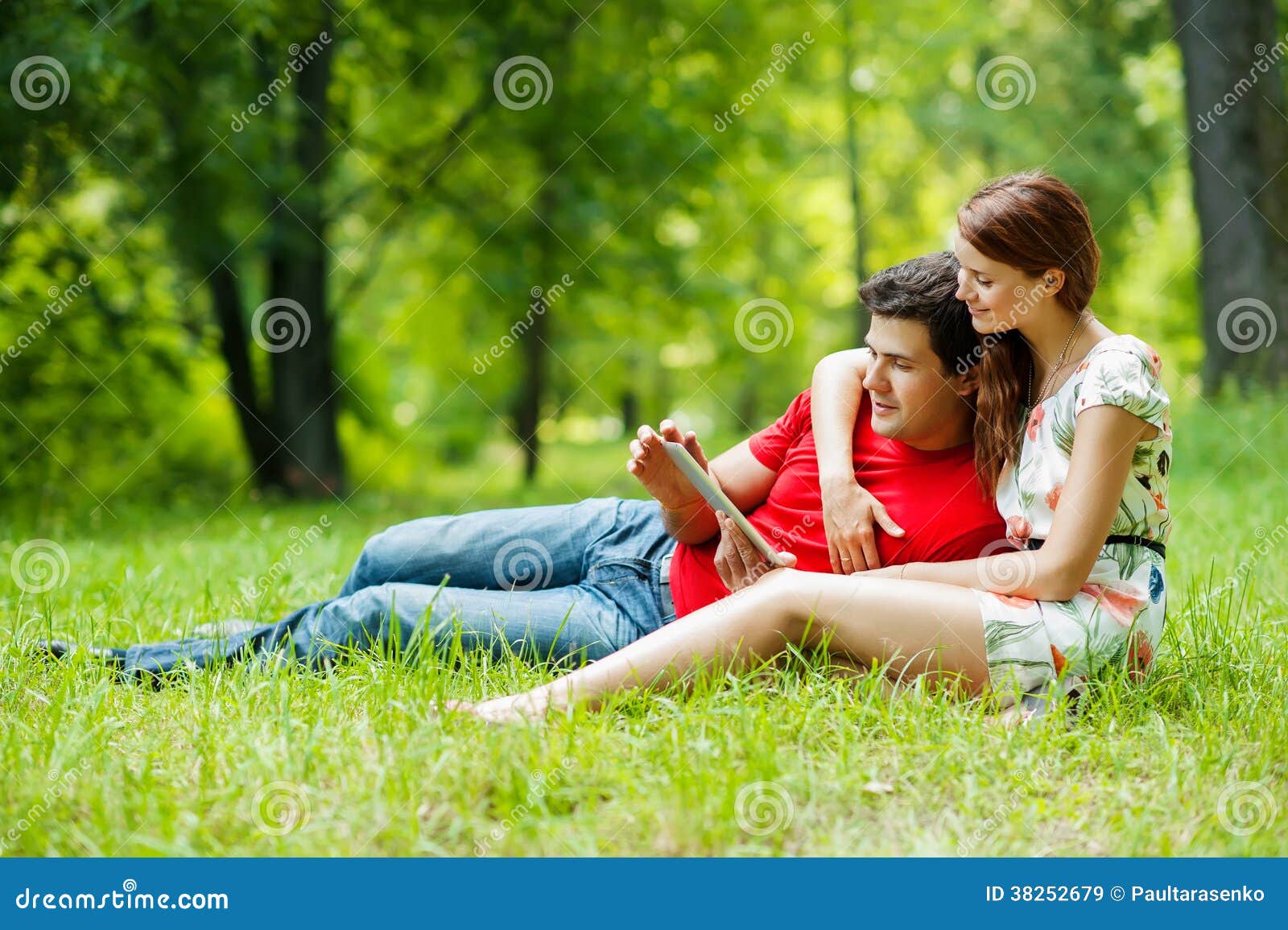 Beautiful Romantic Couple with Tablet Pc at Summer Green Park ...