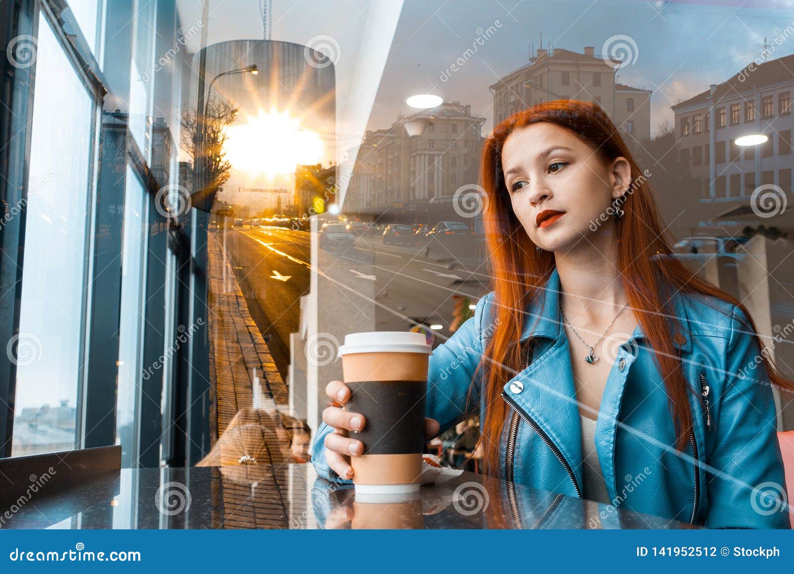 Beautiful Romantic Girl Drinks Coffee In A Cafe Redhaired Woman