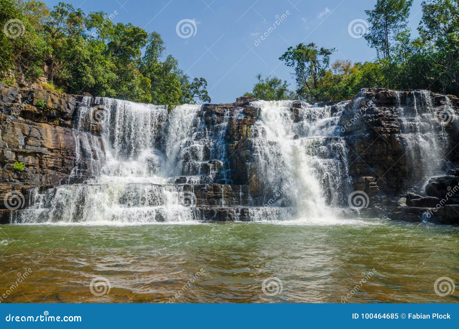 beautiful sala water falls near labe with trees, green pool and a lot of water flow, guinea conakry, west africa