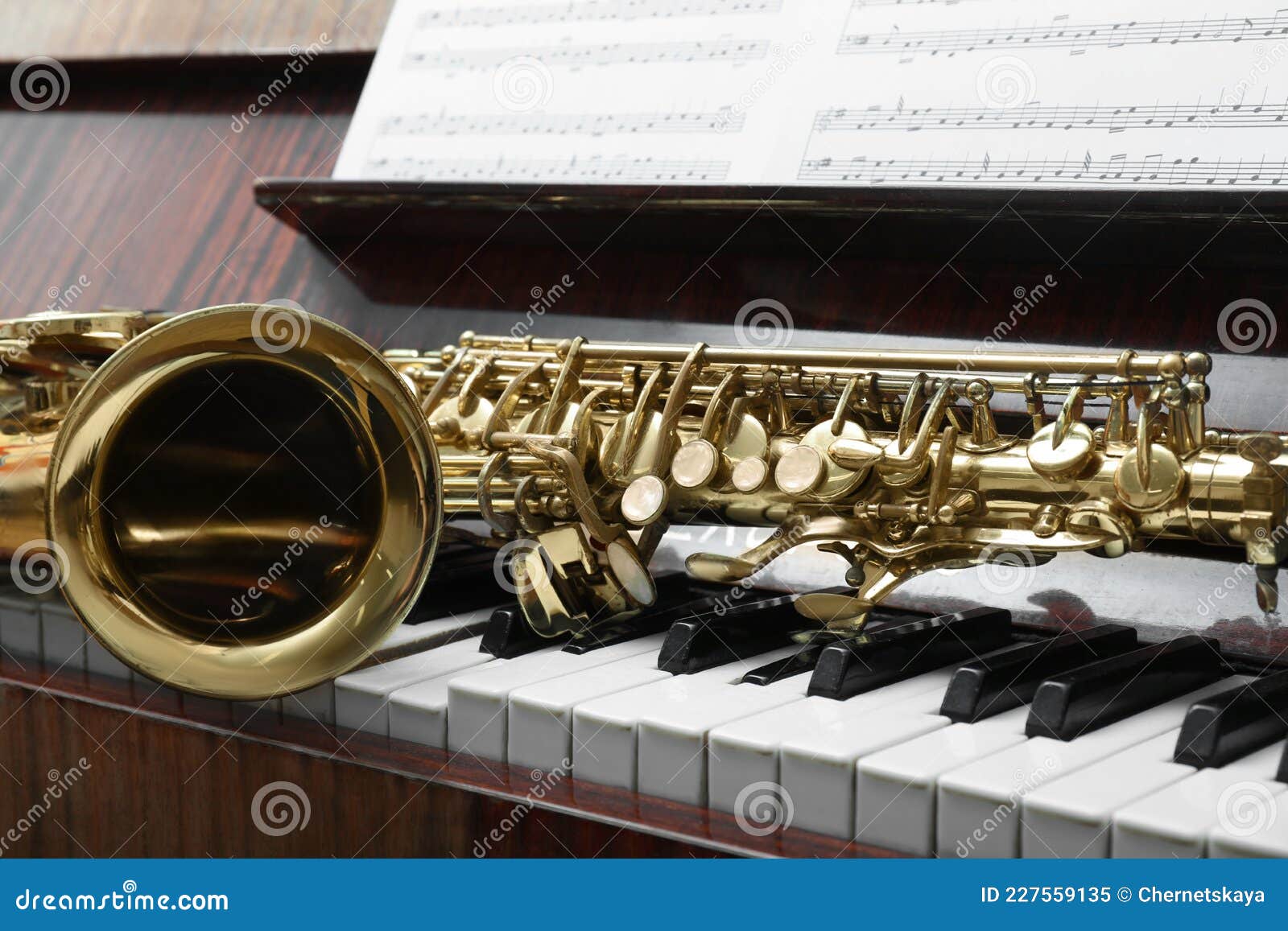Beautiful Saxophone on Piano Keys. Musical Instruments Stock Image