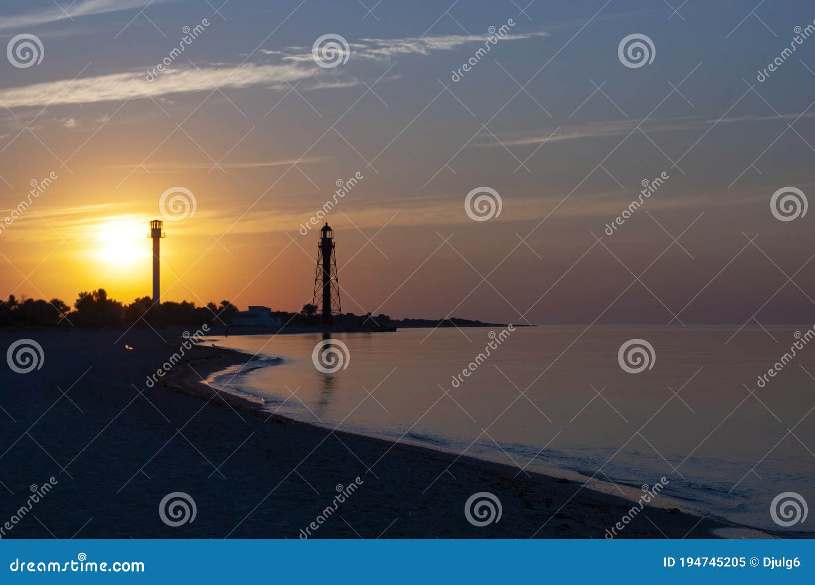 beautiful sea sunrise with lighthouses. lighthouse on dzharylgach island, kherson region. old lighthouse on the seaside in ukraine