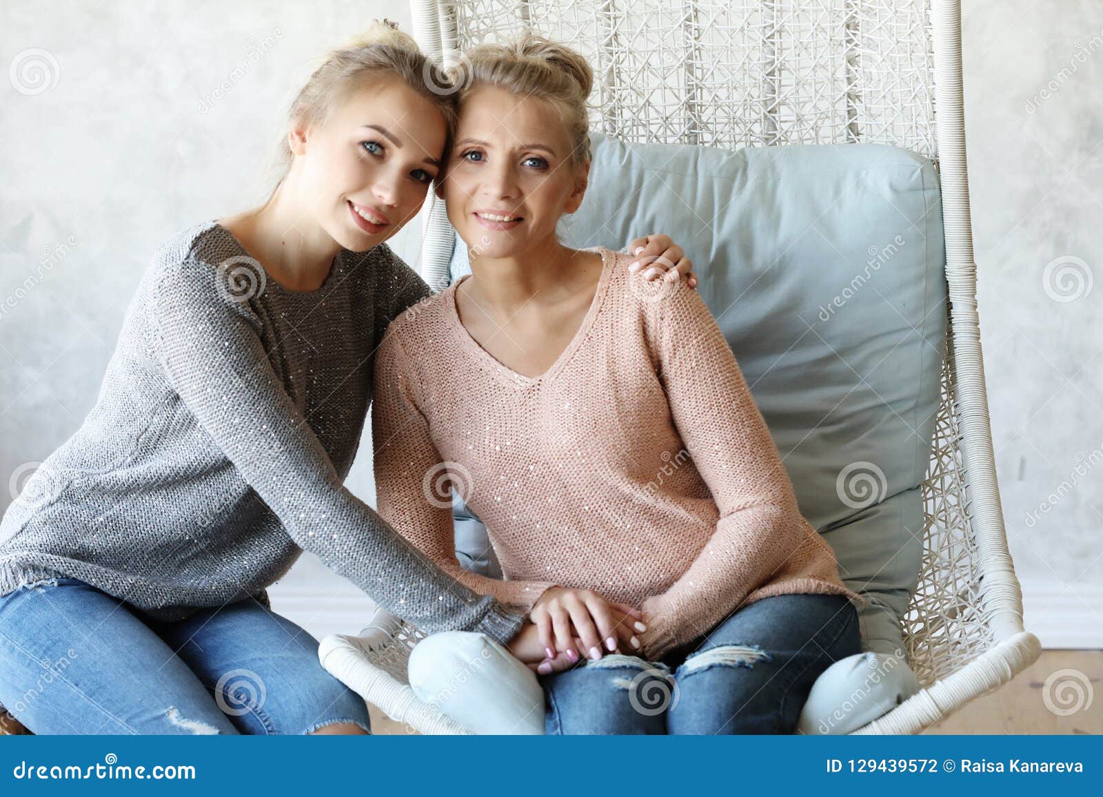 Beautiful Senior Mom And Her Adult Daughter Are Hugging Looking At Camera And Smiling Stock 