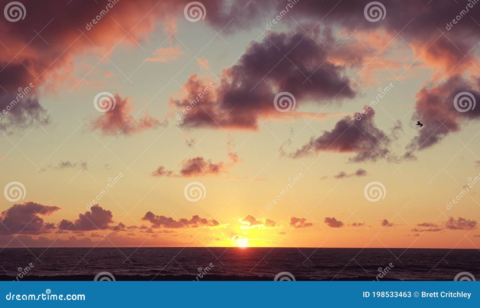 beautiful serene sunset clouds sky over the ocean horizon