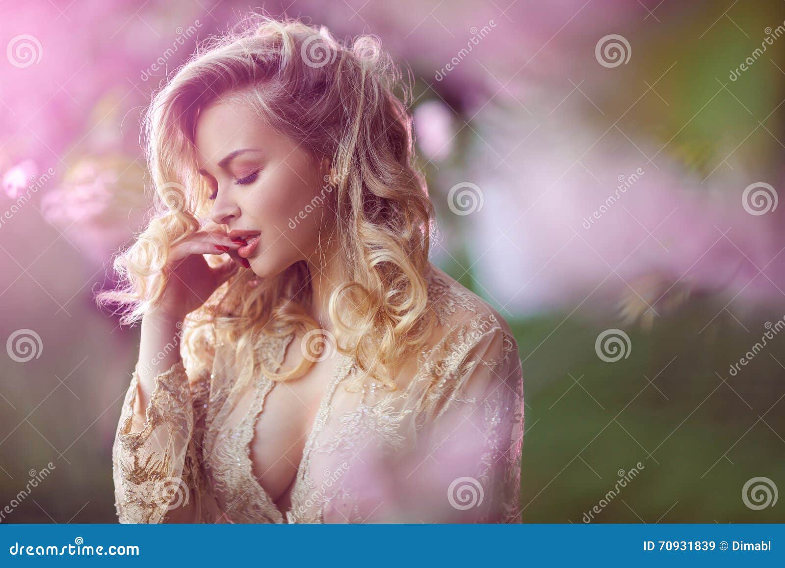 Beautiful Adult Girl Standing At Blossoming Tree In The Garden Stock