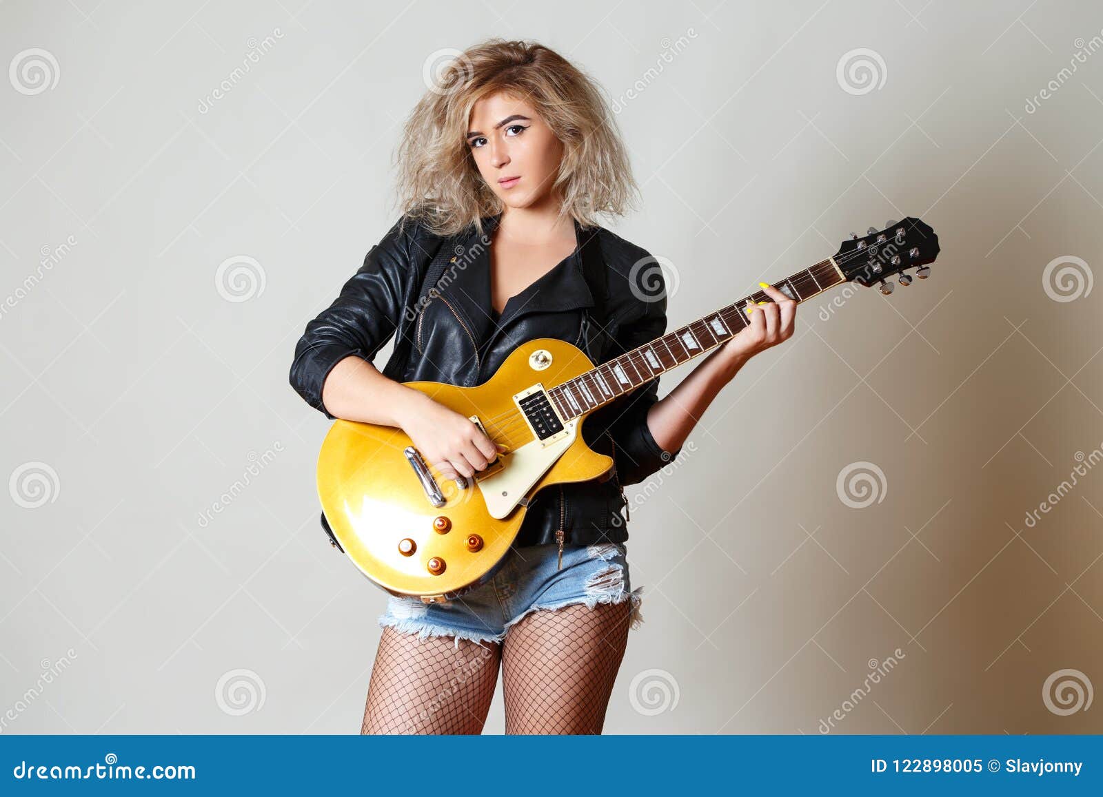 Attractive Girl Musician Plays On Golden Stock Photo 1442288927