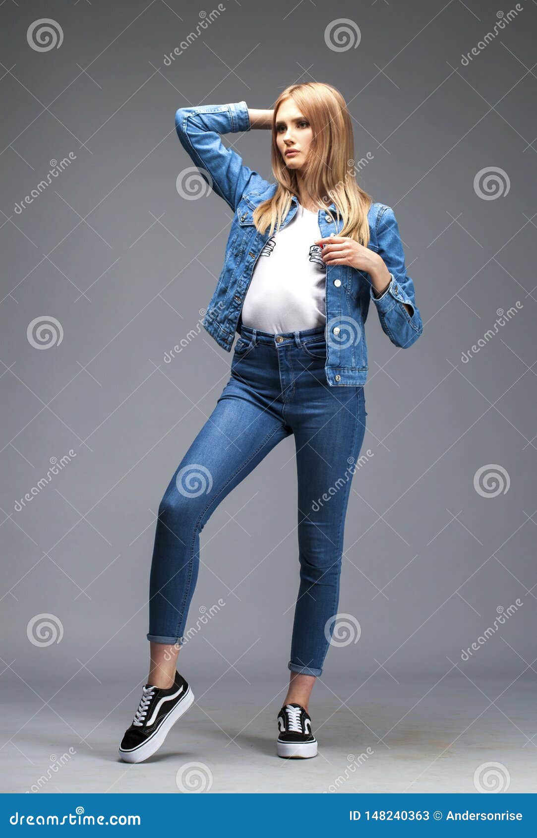 Beautiful Blonde Woman Dressed In A Denim Jacket And Blue Jeans Stock Image Image Of Denim
