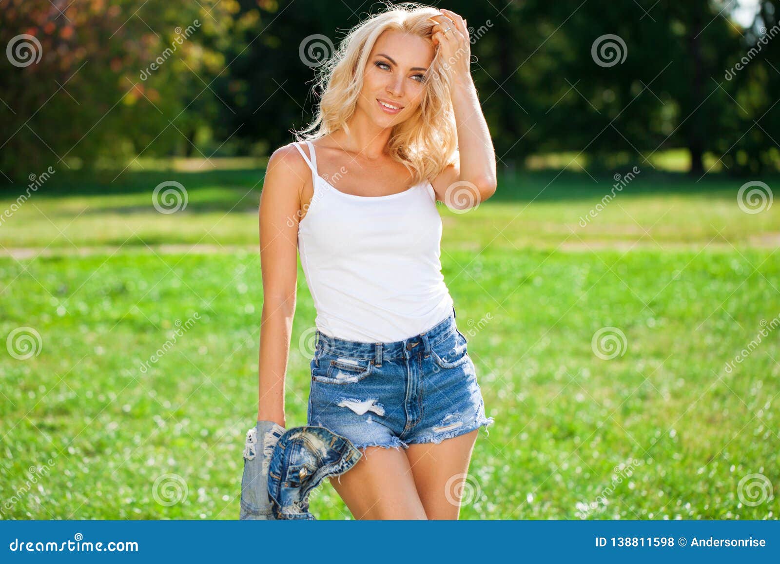 Beautiful Blonde Woman Dressed In A Denim Jacket And Shorts Stock Photo Image Of Caucasian