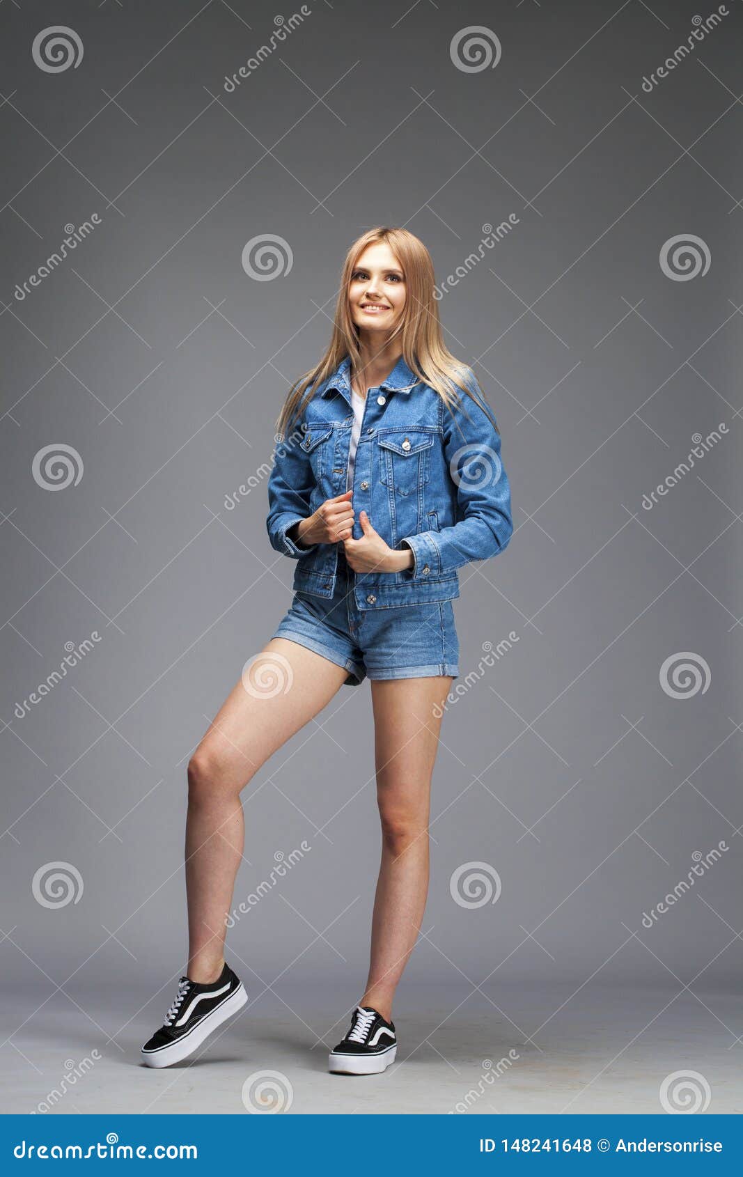 Beautiful Blonde Woman Dressed In A Denim Jacket And Shorts Stock Photo Image Of Indoor