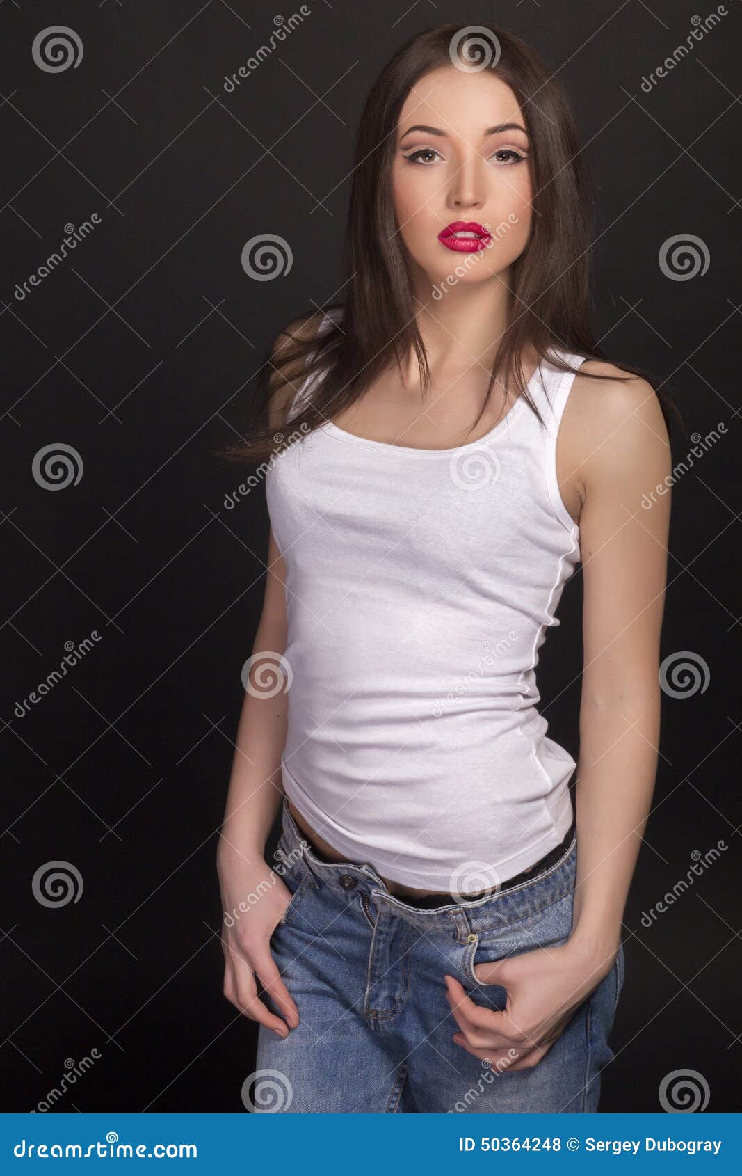 Beautiful Girl in a White T-shirt and Jeans Stock Photo - Image of