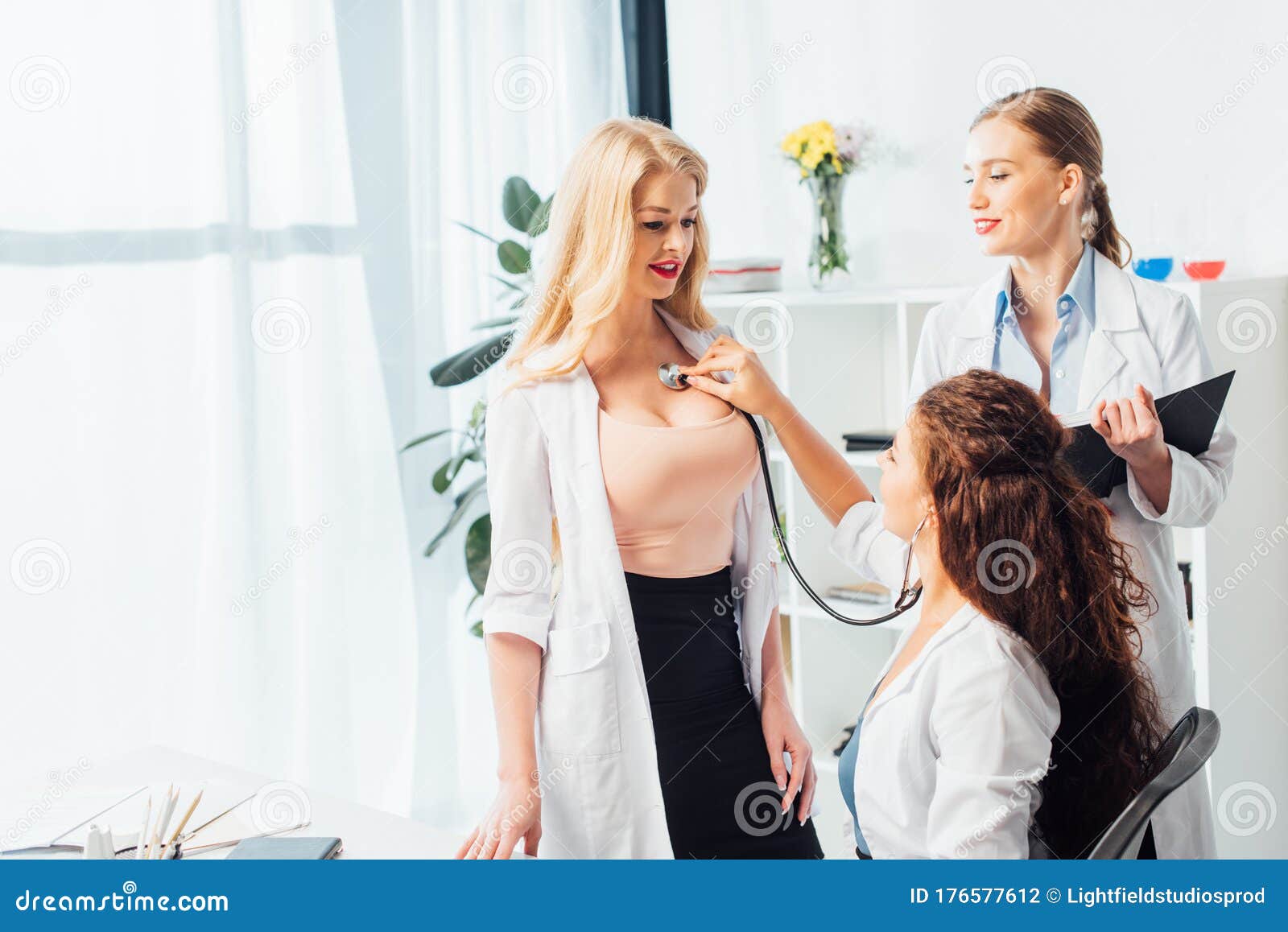 Nurse Examining Woman with Big Stock Photo - Image of positive,  stethoscope: 176577612