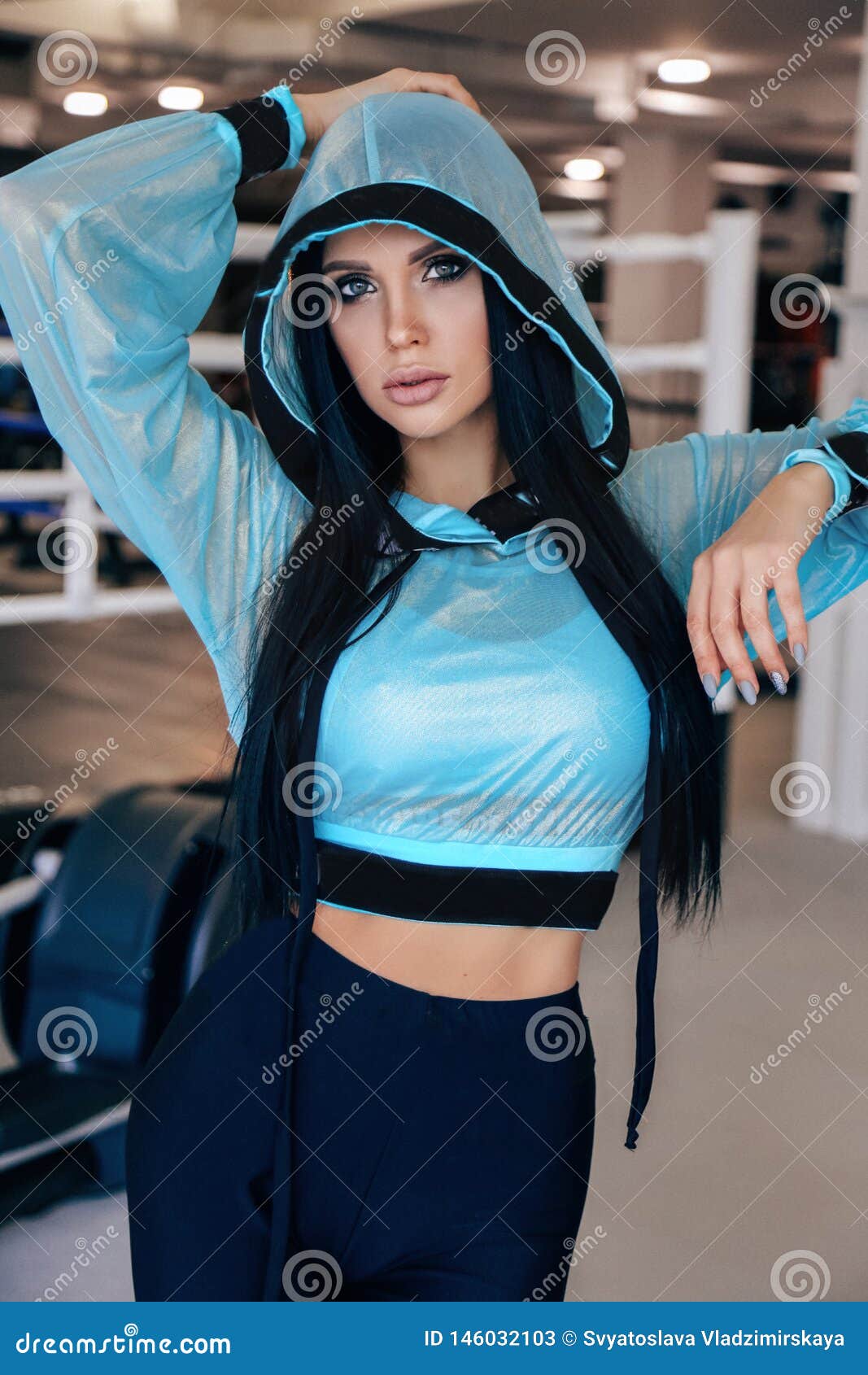 Beautiful Woman with Dark Hair in Sportive Clothes Training in Gym ...