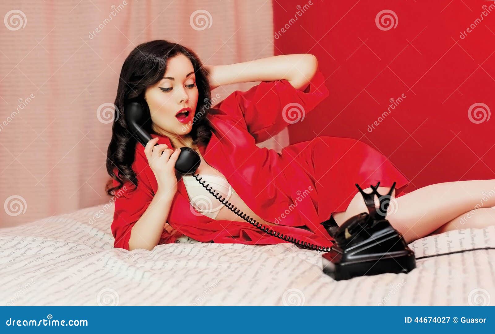 Beautiful Sexy Woman Lying On The Bed With Telephone Stock