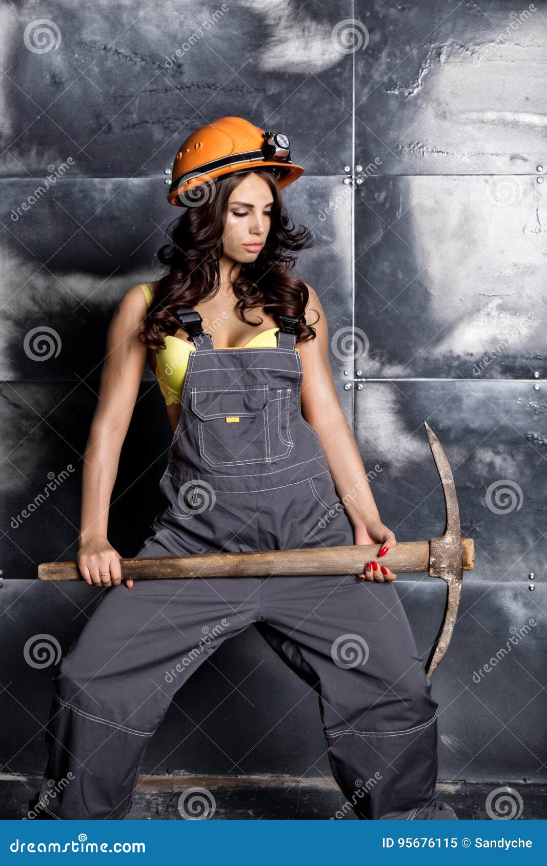Beautiful Worker with a Pickaxe. Seductive and Beautiful Woman Miner on ...