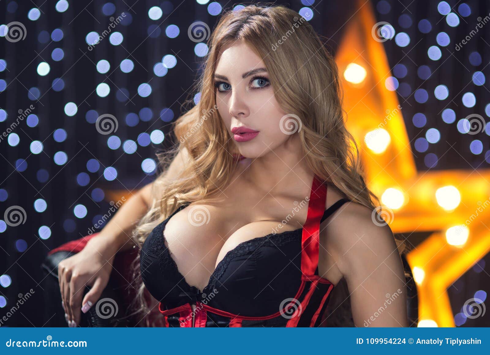 Young Woman with Big Breast Lingerie on the Background of a Stock