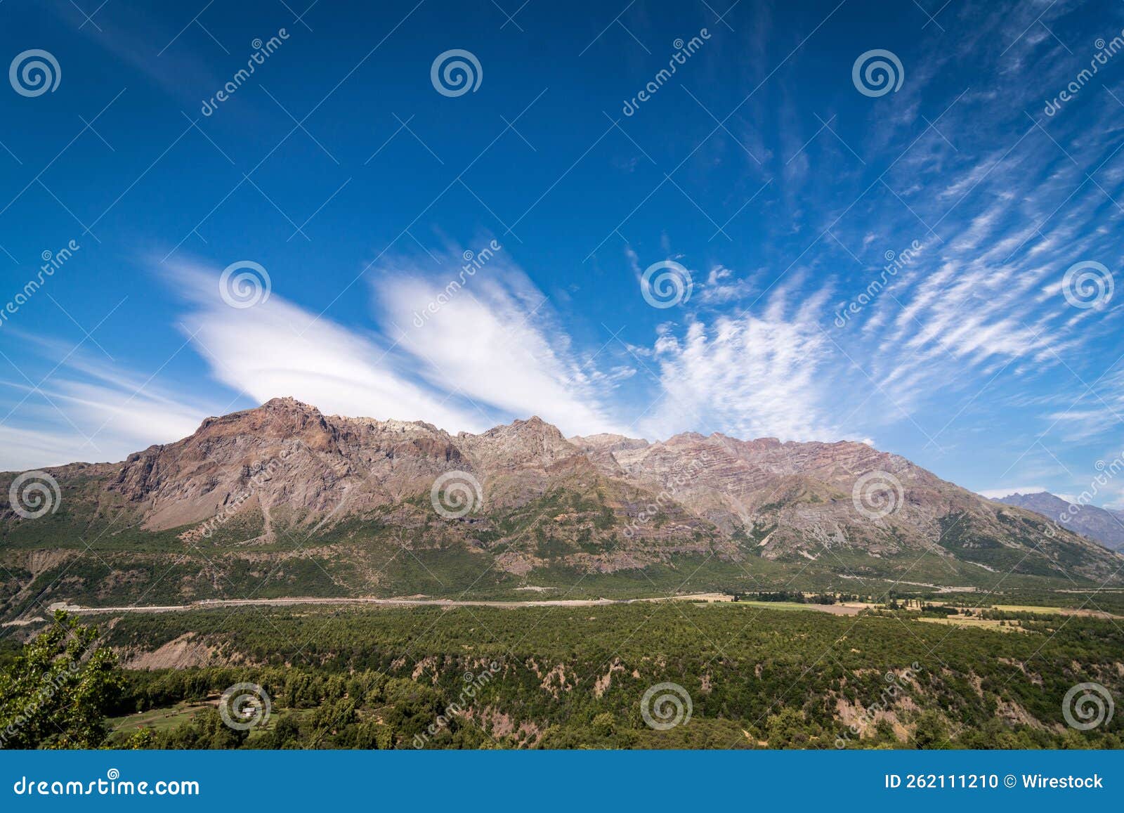 beautiful shot of greenery-covered hills and mountains in rio los cipreses national reserve in chile