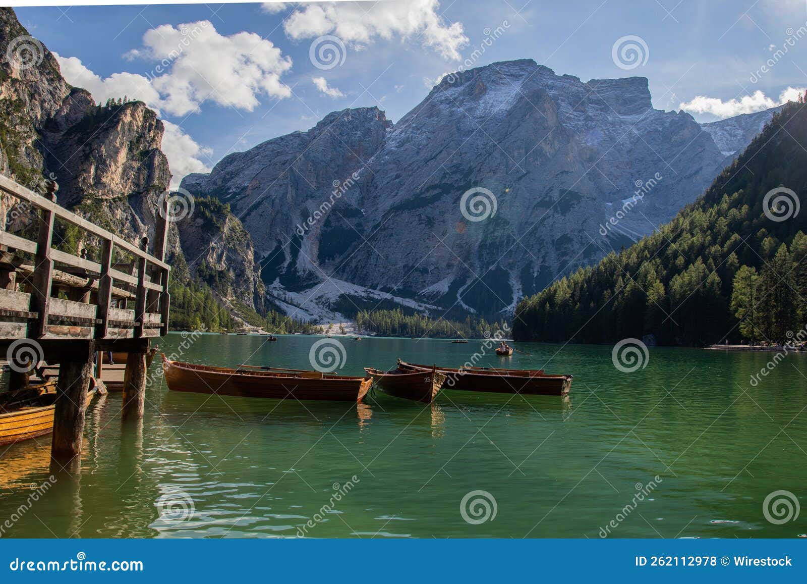 beautiful shot of a group of boats on calm water in the fanes-sennes-braies nature park in italy