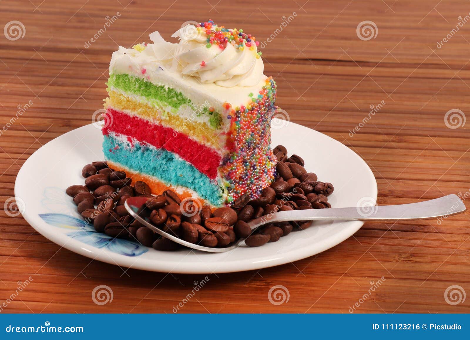 beautiful colorful children's birthday cake for a girl. cake with a rainbow,  clouds and a figurine of a girl. the concept of a children's holiday Stock  Photo | Adobe Stock