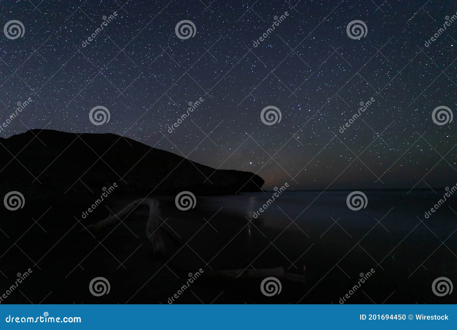 beautiful  shot of a starry sky over the beach of media luna, spain