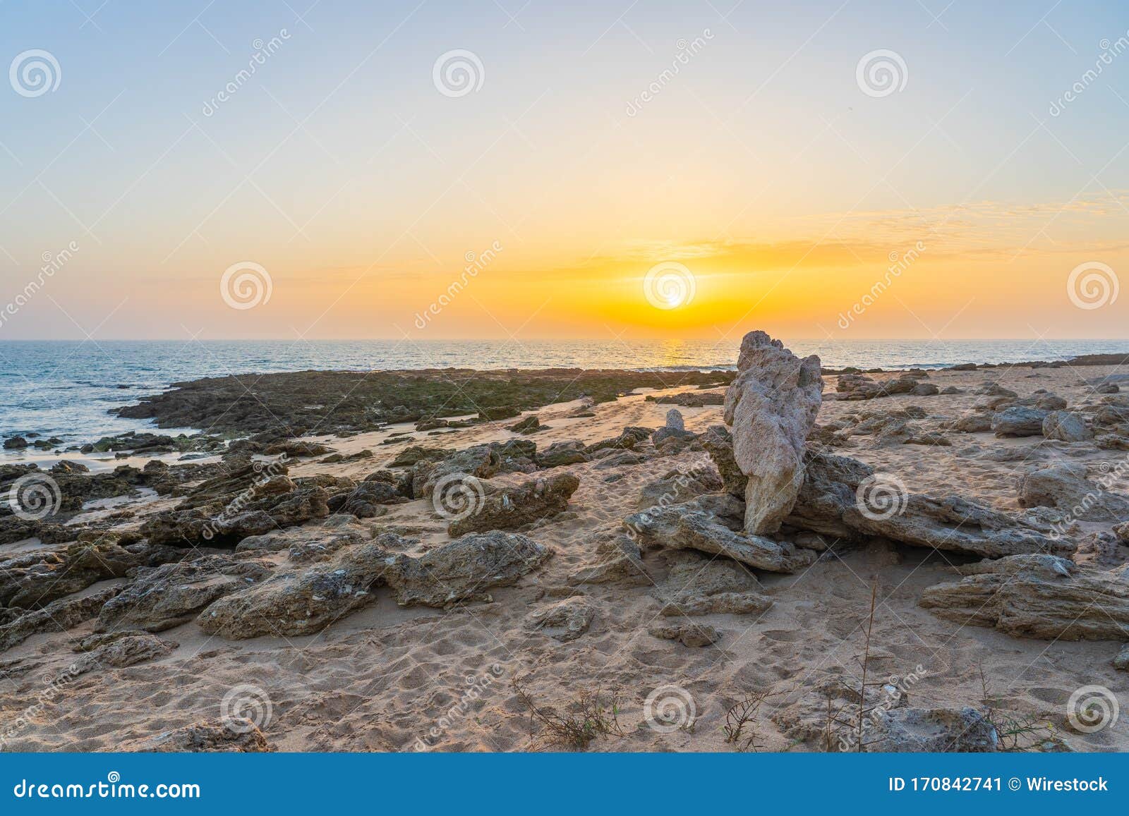 beautiful shot of a sunrise in the seashore of zahora spain