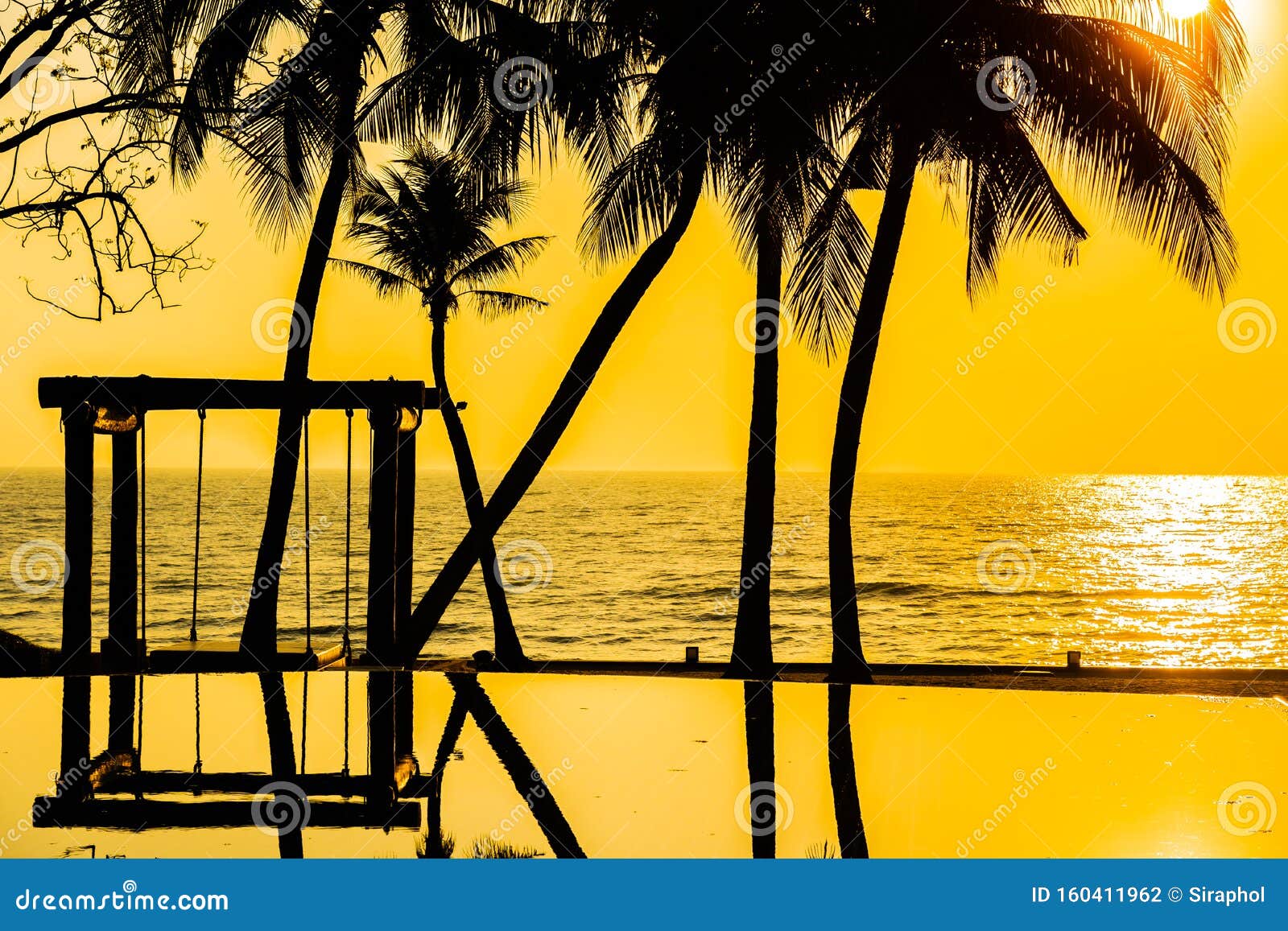 Beautiful Silhouette Coconut Palm Tree On Sky Around Swimming Pool In