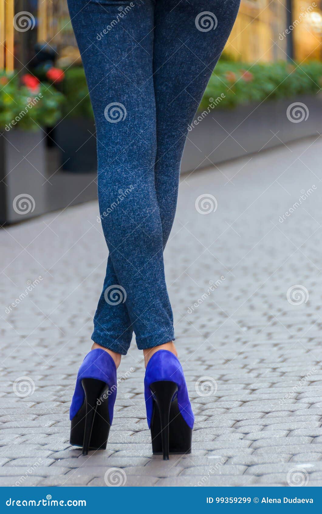 Beautiful Slender Female Legs in Tight Jeans and Blue Shoes on a Stock ...