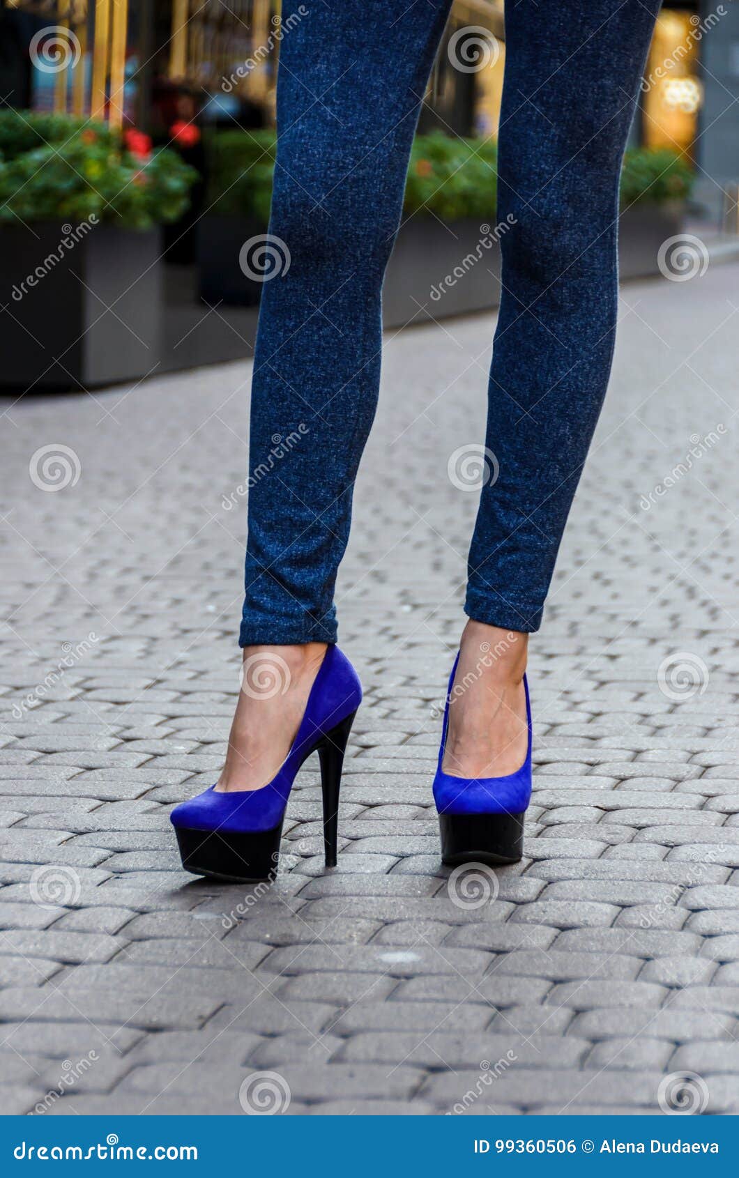 Beautiful Slender Female Legs in Tight Jeans and Blue Shoes on a Stock ...