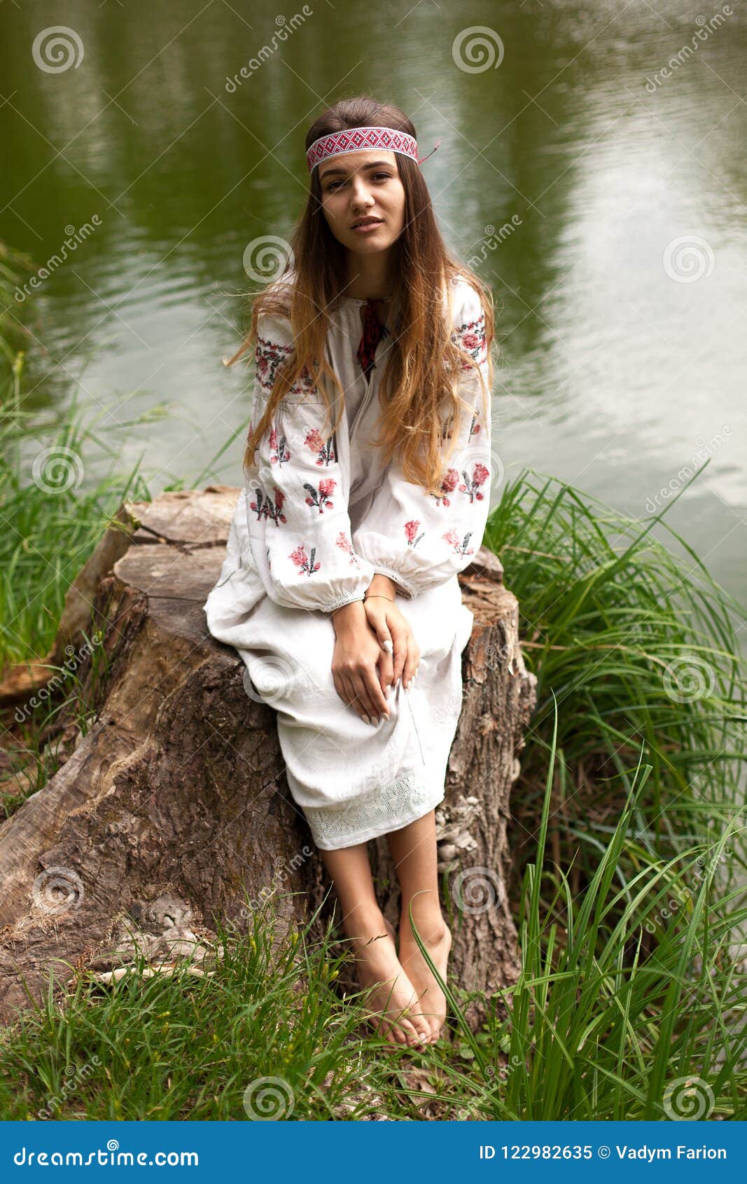 Steep Slender Ukrainian Woman Resting Sitting on a Stump on the Stock ...