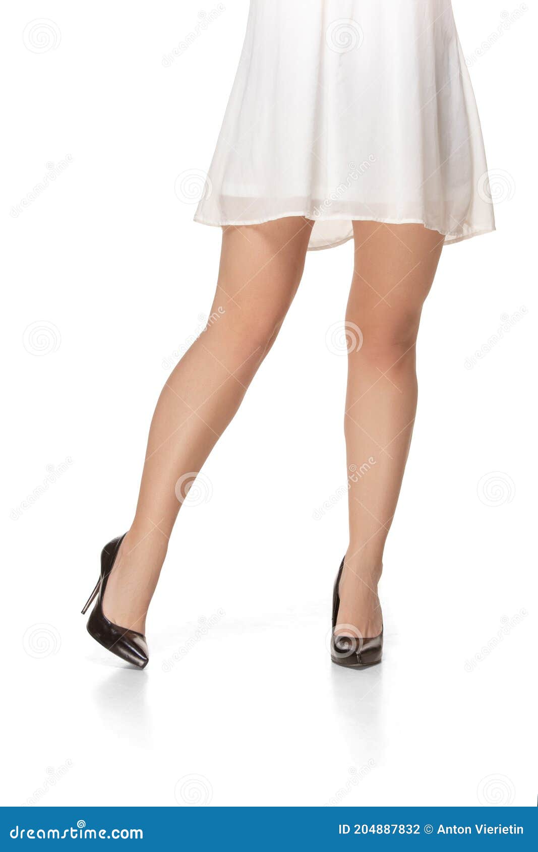 Beautiful Slim Female Legs In Romantic White Dress On White Background ...