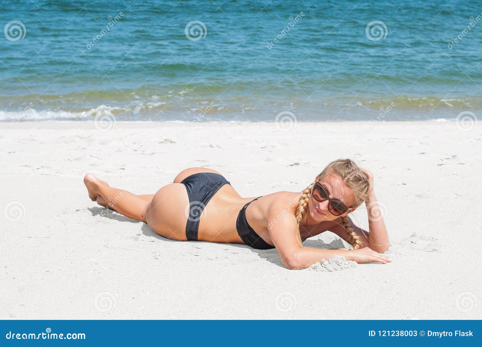 Beautiful Slim Woman In Bikini Lying On Sand On The Beach Stock Image