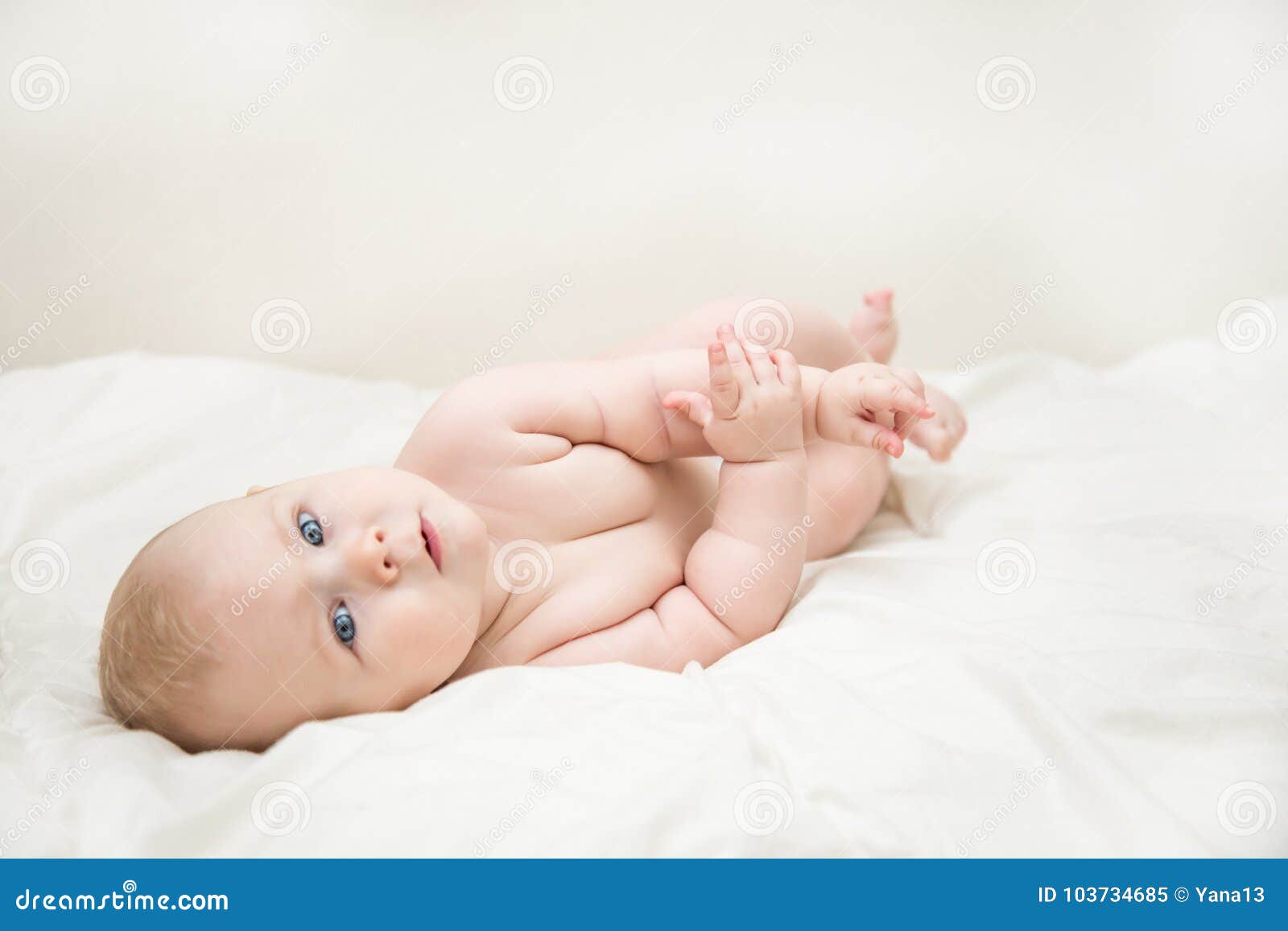 Beautiful Smiling Cute Baby Girl with Blue Eyes Lying on the Back ...