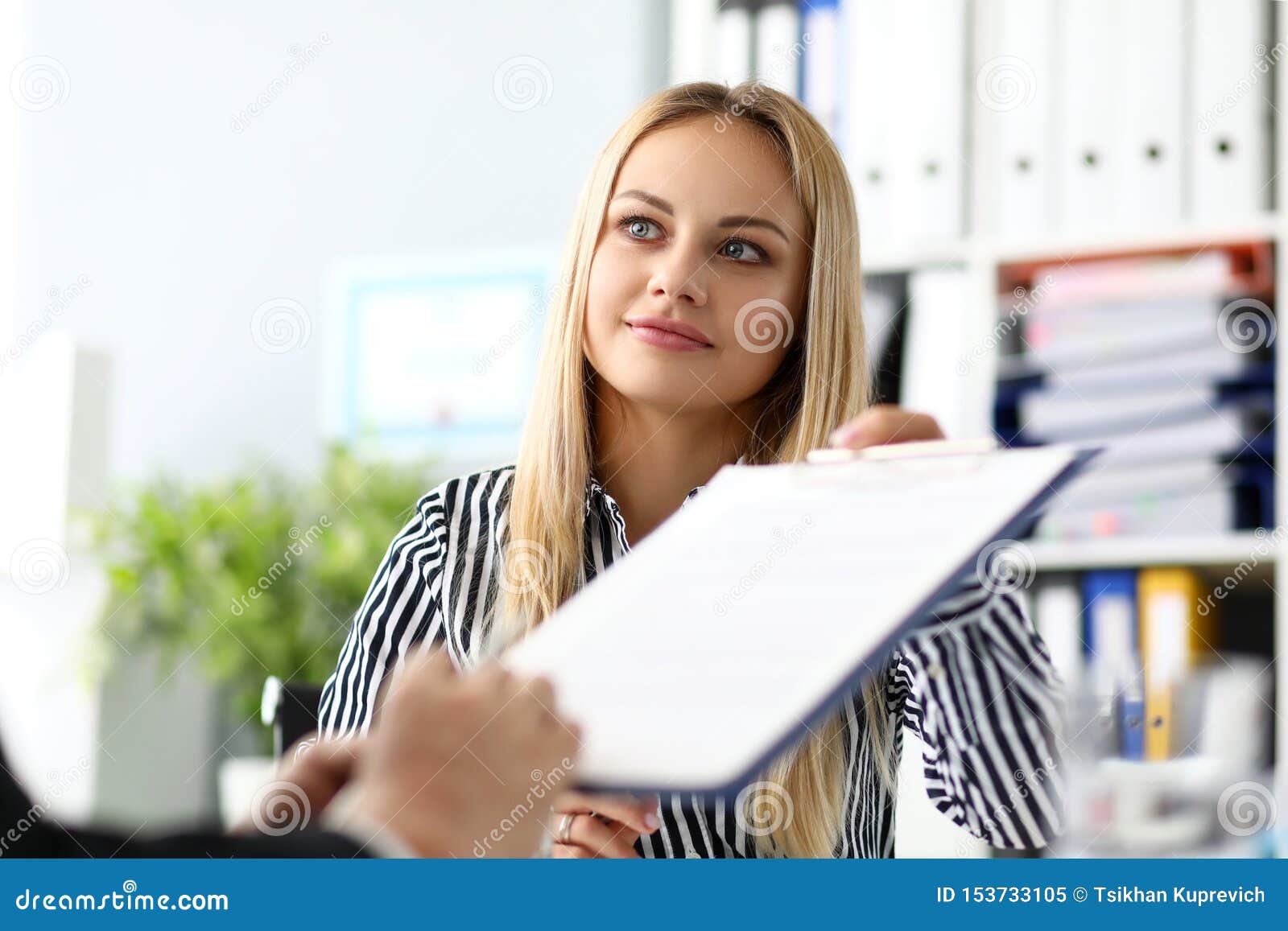 Beautiful Smiling Female Real Estate Agent Offering Male Visitor 