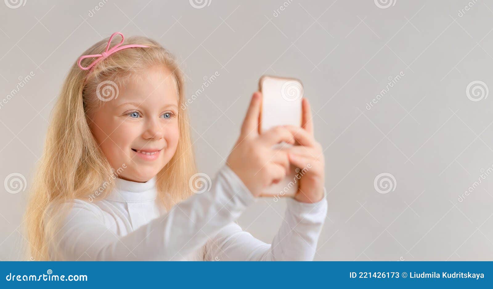 Beautiful Smiling Little Girl Taking a Selfie Photo with Smartphone ...