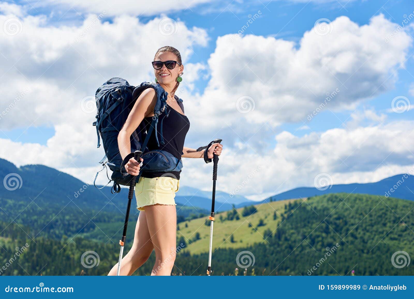 Woman Wearing A Backpack Hiking The Alps. Stock Images 
