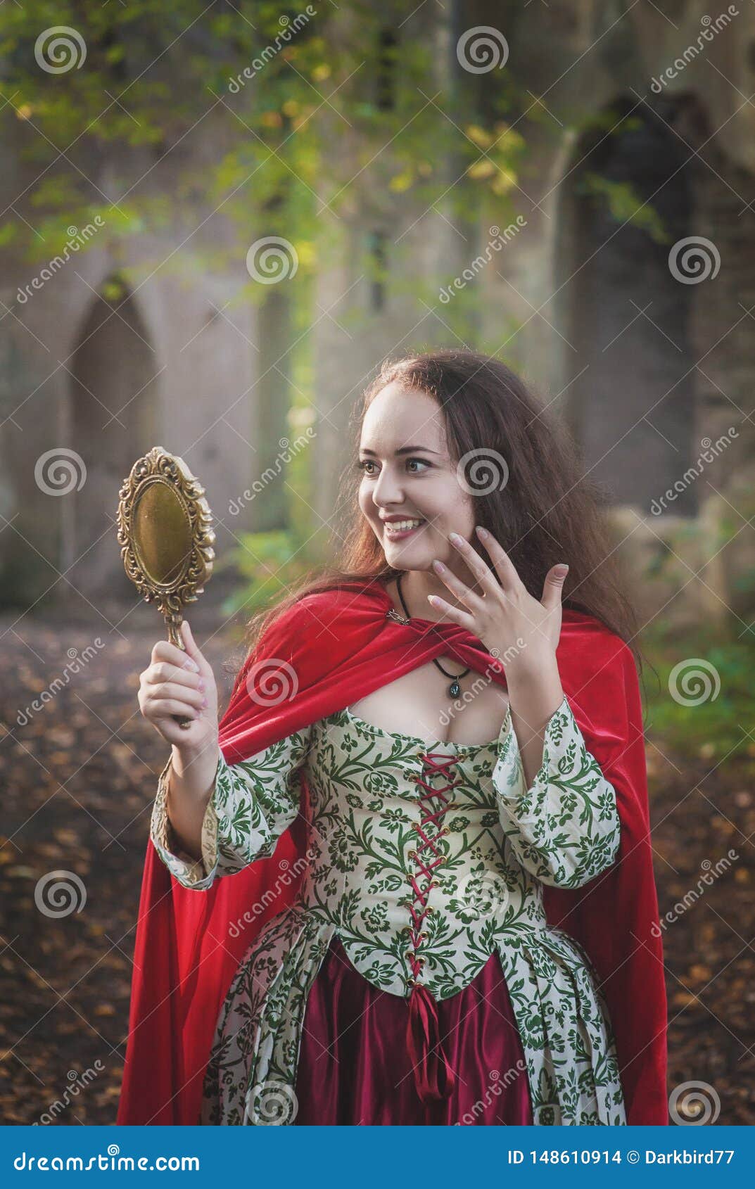 Beautiful Smiling Woman in Long Medieval Dress with Mirror Stock Photo ...