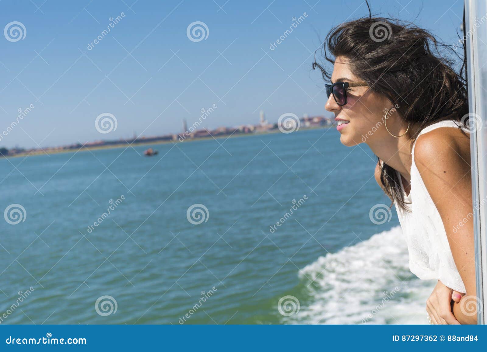 Beautiful Smiling Woman Sailing on a Boat with Wind in the Hair Stock ...