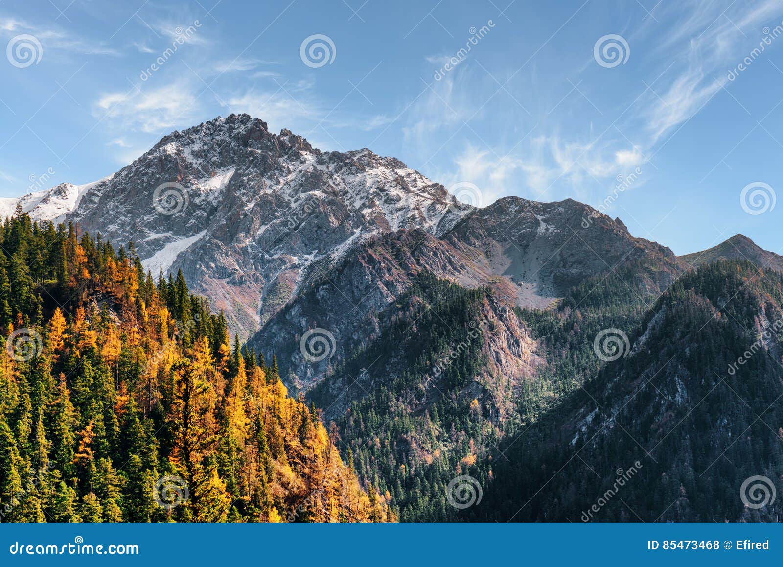 Beautiful Snow Capped Mountains On Blue Sky Background Stock Photo