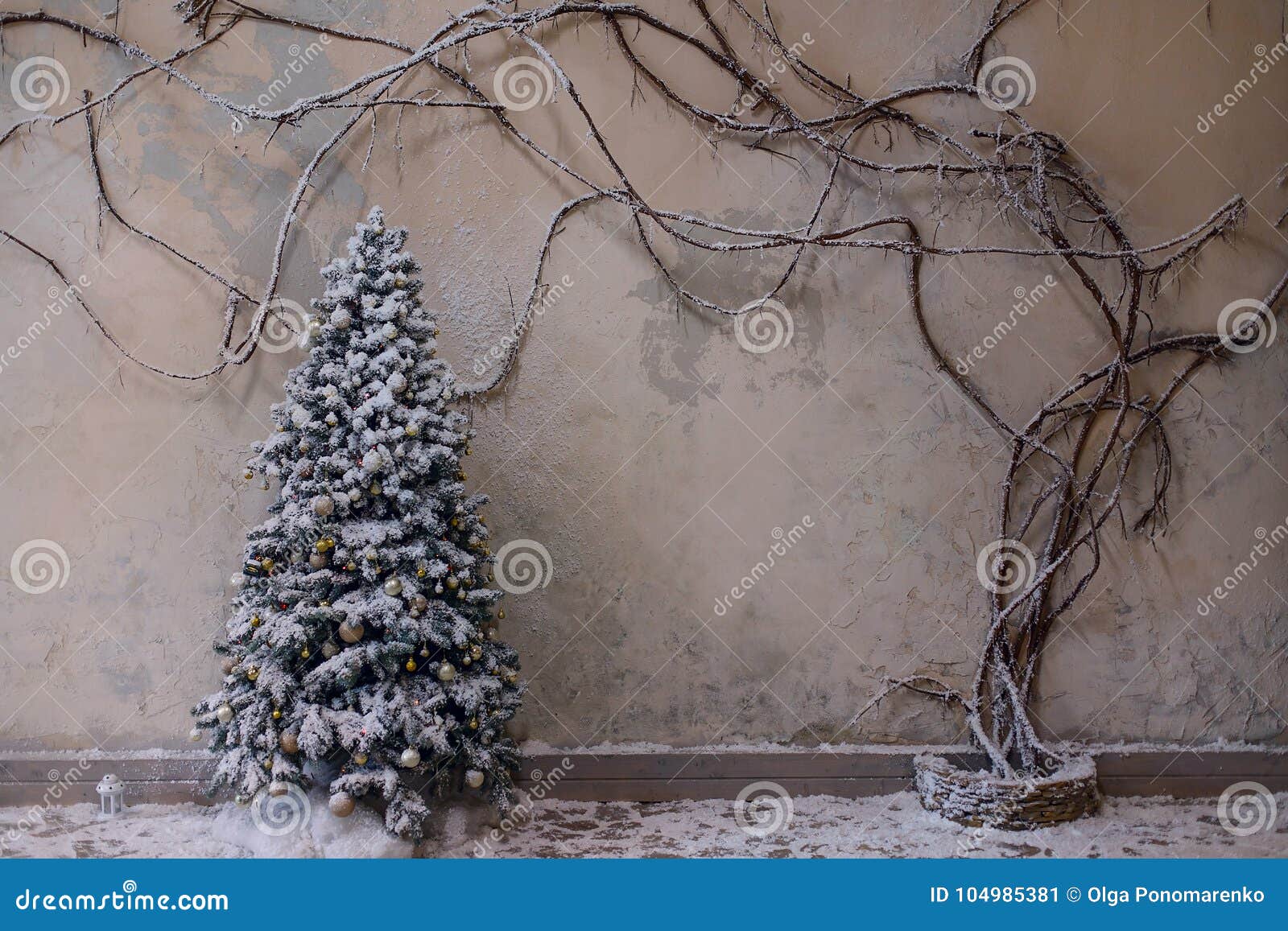 Christmas decoration, interior, background. Beautiful snowy christmas tree in the holiday interior. Empty space for text.Winter christmas background.