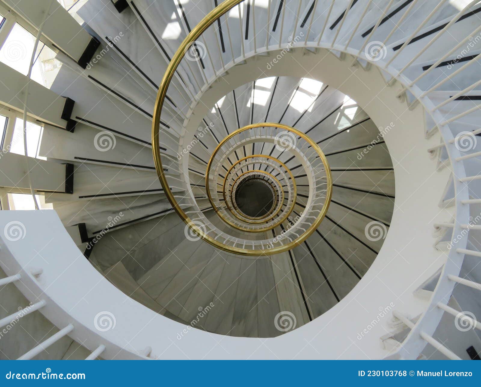 beautiful spiral staircase with golden handrails  circular s
