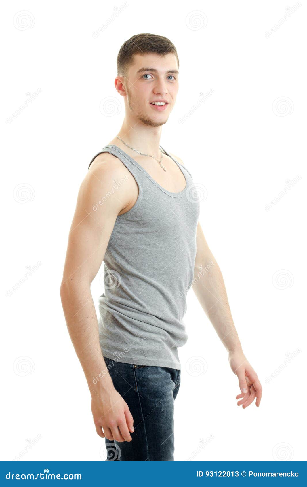 Beautiful Sporty Young Guy Standing in a T-shirt and Looking at Camera ...