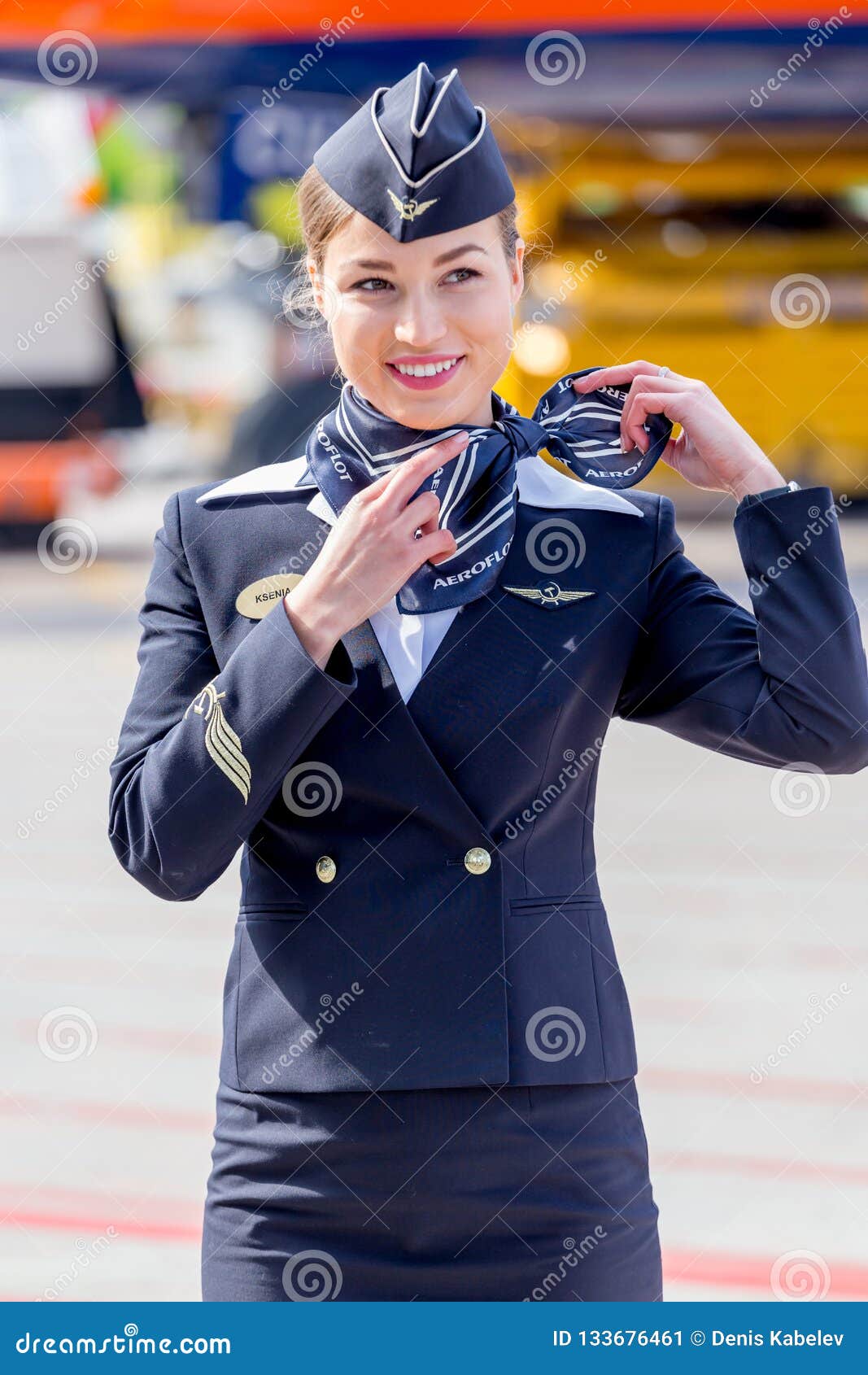 Beautiful Stewardess Dressed In Official Dark Blue Uniform 