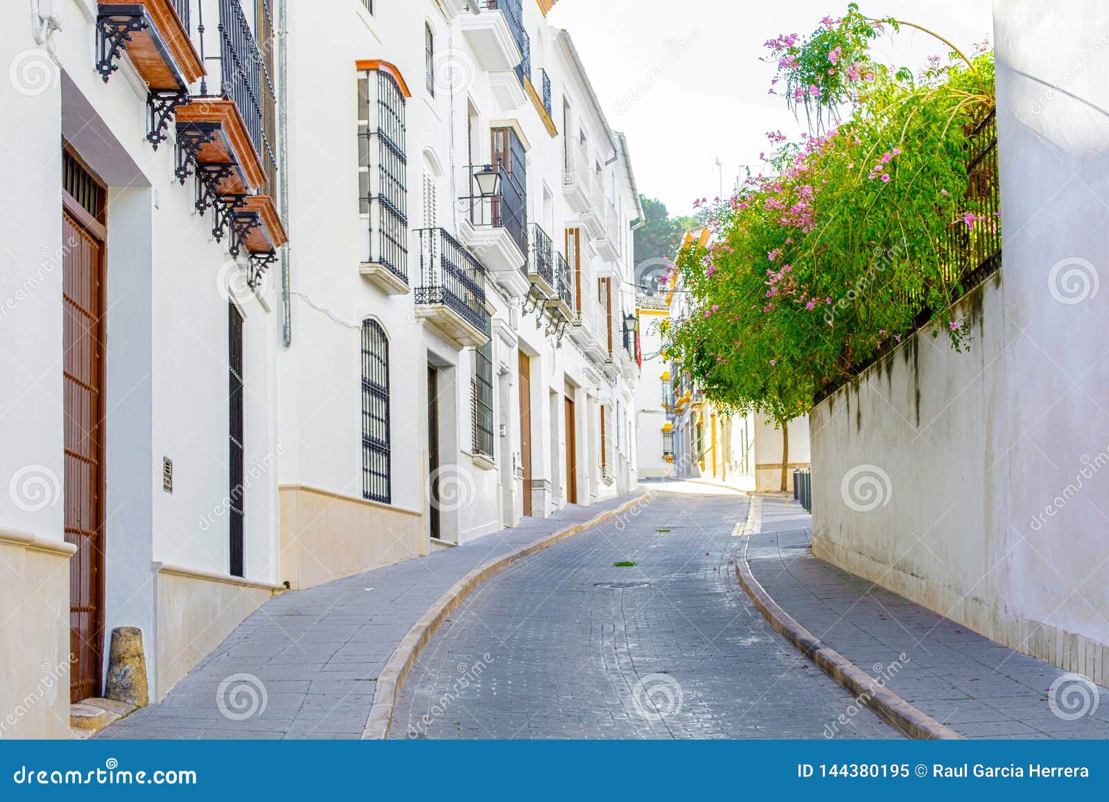 beautiful street in estepa, province of seville. charming white village in andalusia. southern spain.