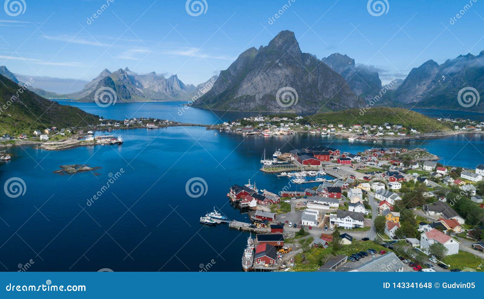 beautiful summer aerial view of reine, norway, lofoten islands, with skyline, mountains, famous fishing village with red fishing c